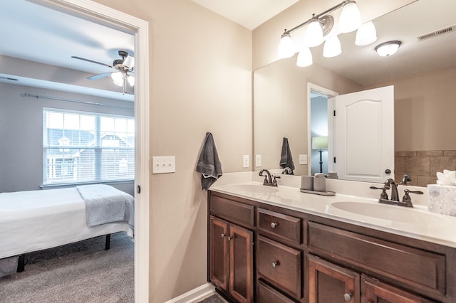 bathroom with ceiling fan and vanity