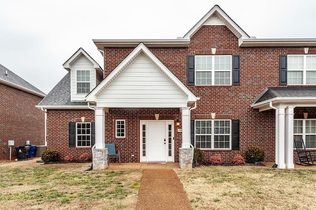 view of front of property with a front lawn