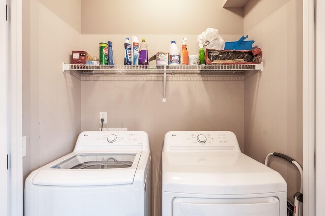 washroom featuring independent washer and dryer