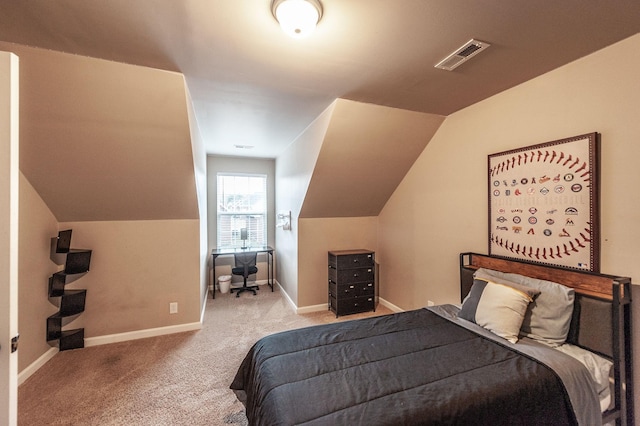 bedroom with light carpet and lofted ceiling