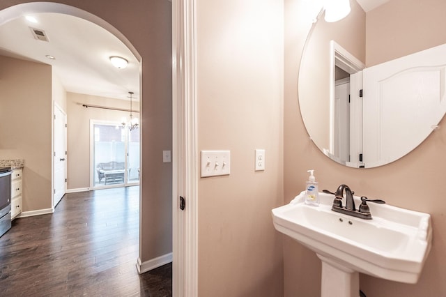 bathroom featuring sink and wood-type flooring