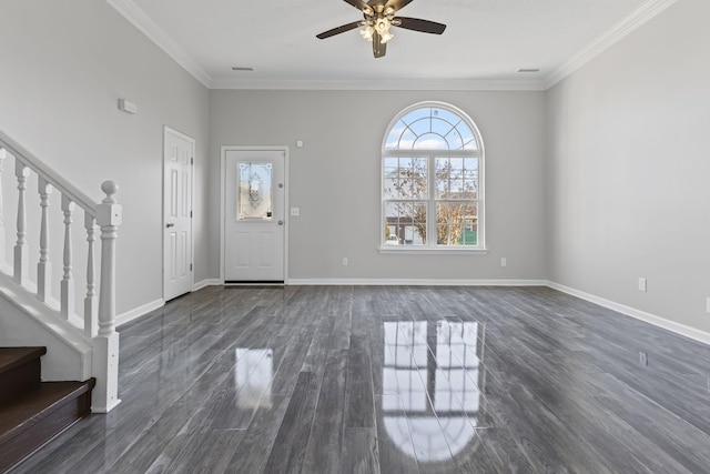 foyer entrance featuring dark hardwood / wood-style flooring, crown molding, and ceiling fan