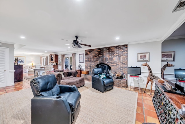 tiled living room featuring a brick fireplace, crown molding, and ceiling fan