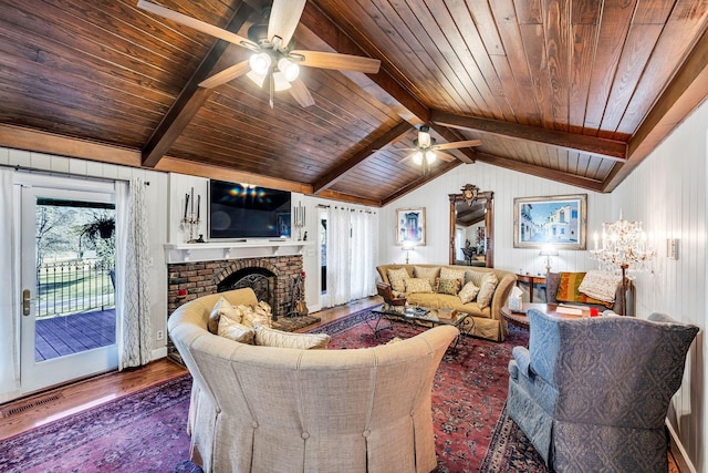 living room with wood ceiling, wood-type flooring, lofted ceiling with beams, and a brick fireplace