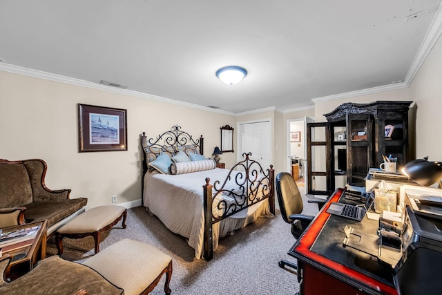 bedroom with crown molding, carpet floors, and a closet