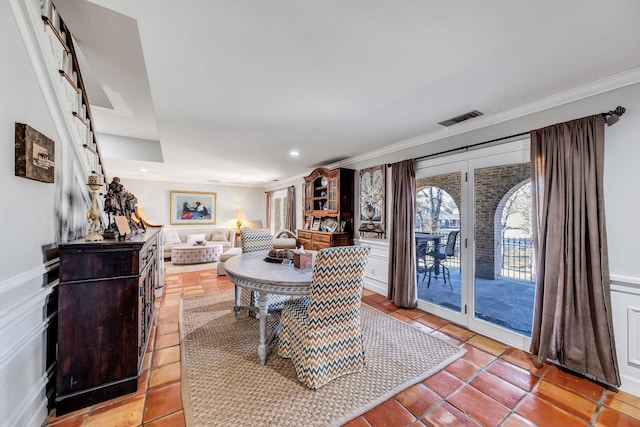 dining room featuring crown molding