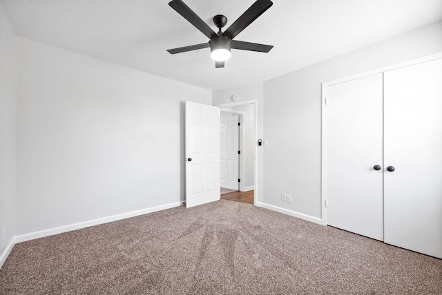 unfurnished bedroom featuring carpet floors, ceiling fan, and a closet