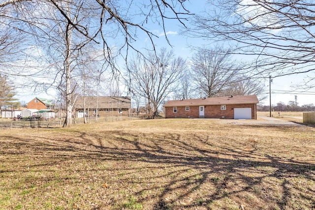 view of yard with a garage