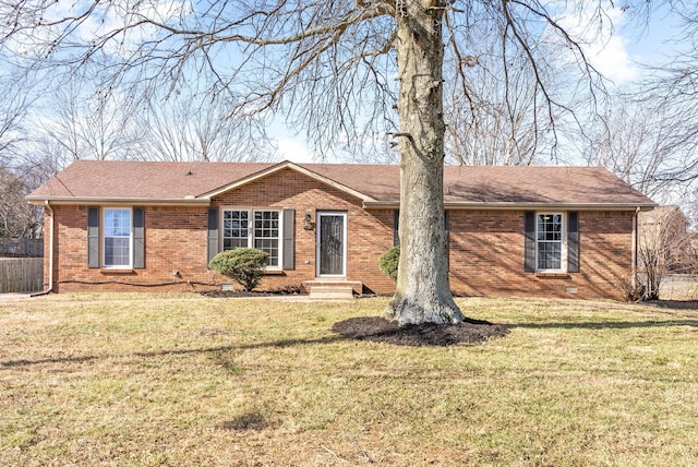 ranch-style house featuring a front yard