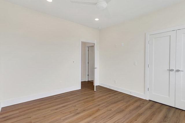 unfurnished bedroom with light hardwood / wood-style floors and ceiling fan