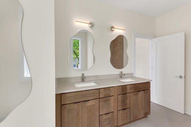 bathroom featuring tile patterned flooring and vanity