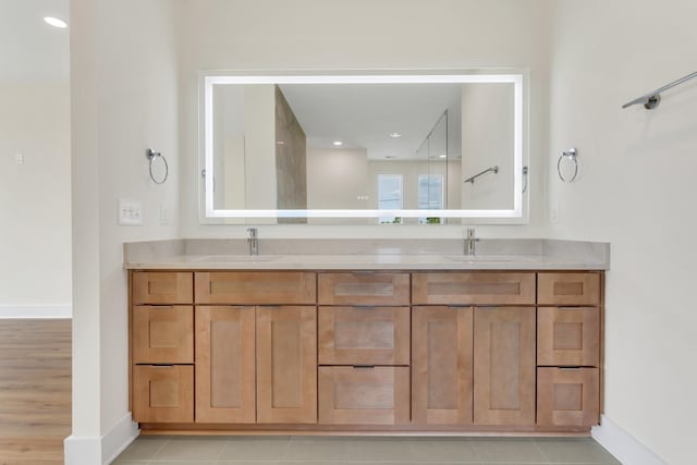 bathroom with tile patterned flooring and vanity