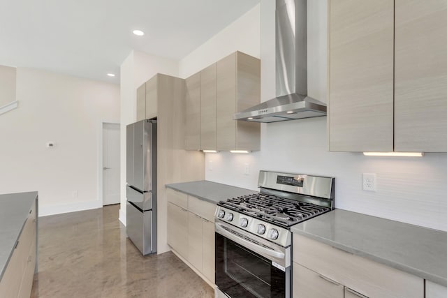 kitchen featuring wall chimney exhaust hood and appliances with stainless steel finishes