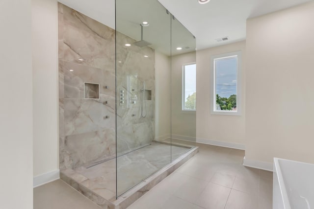 bathroom with a tile shower