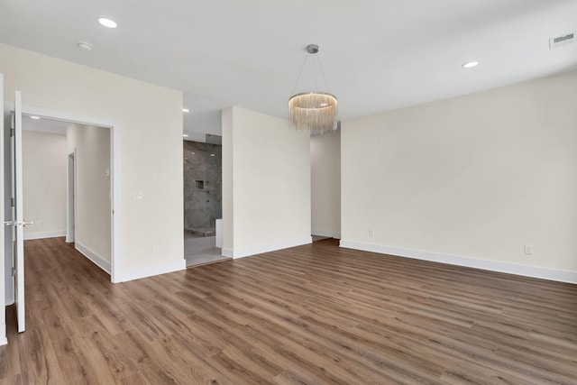 spare room featuring dark hardwood / wood-style floors