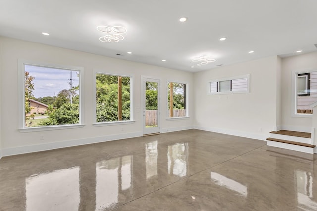 unfurnished room with concrete floors