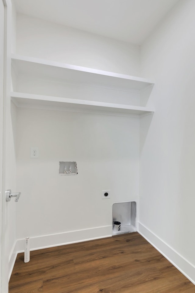 laundry area featuring electric dryer hookup and dark hardwood / wood-style floors