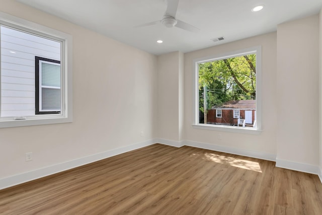 empty room featuring ceiling fan and light wood-type flooring