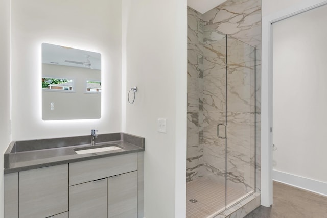 bathroom with vanity and an enclosed shower