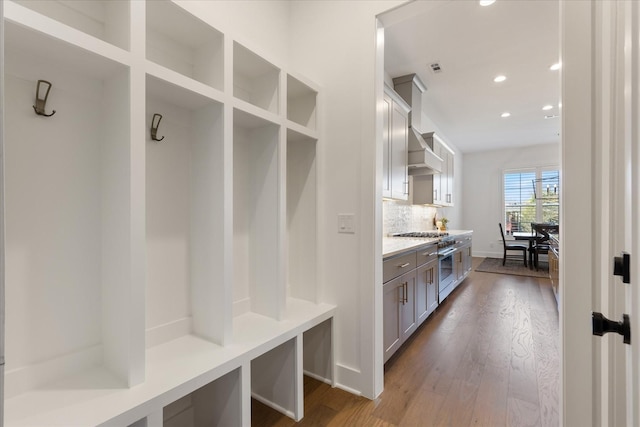 mudroom with hardwood / wood-style floors