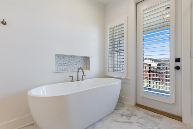 bathroom with a tub