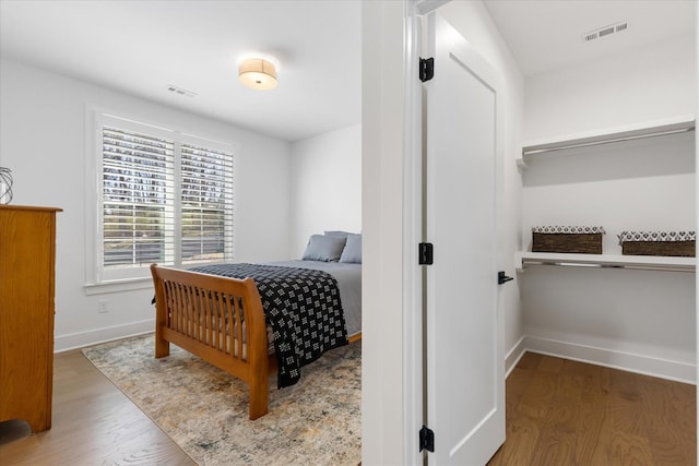 bedroom with hardwood / wood-style flooring