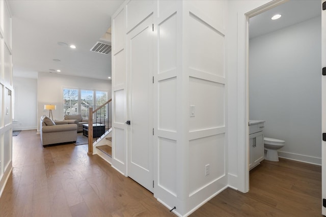 hallway featuring wood-type flooring