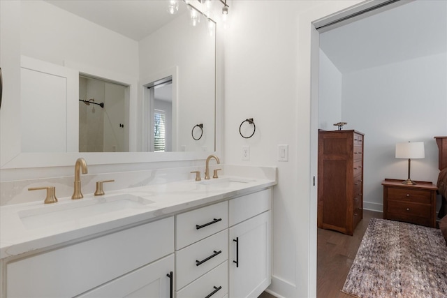 bathroom with vanity and wood-type flooring