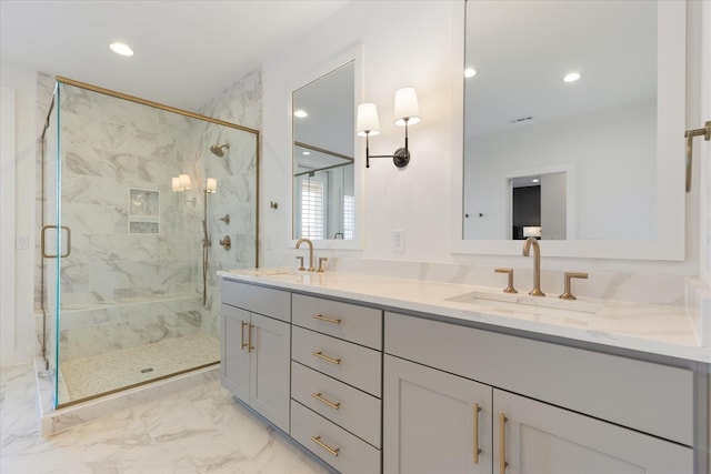 bathroom featuring vanity and a shower with shower door