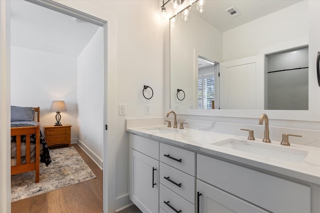 bathroom with vanity and hardwood / wood-style flooring