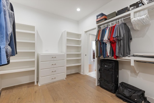 walk in closet featuring light hardwood / wood-style floors