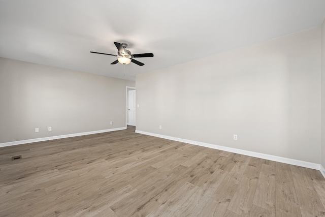 spare room with ceiling fan and light hardwood / wood-style flooring