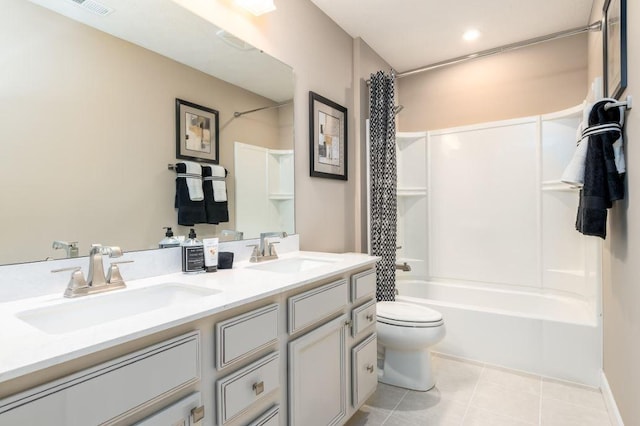 full bathroom with vanity, toilet, tile patterned floors, and shower / bath combo with shower curtain