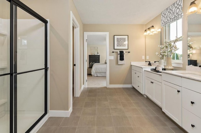 bathroom featuring vanity, tile patterned floors, and walk in shower