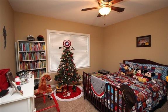 carpeted bedroom featuring ceiling fan