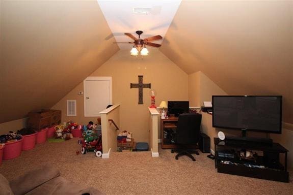 home office with ceiling fan, lofted ceiling, and carpet flooring