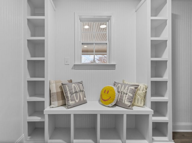 mudroom featuring built in features and dark hardwood / wood-style floors