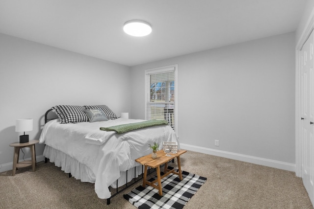 bedroom with a closet and carpet