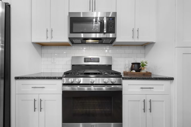 kitchen featuring white cabinetry, appliances with stainless steel finishes, and backsplash