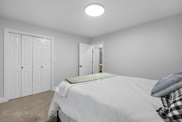 bedroom with carpet and a closet