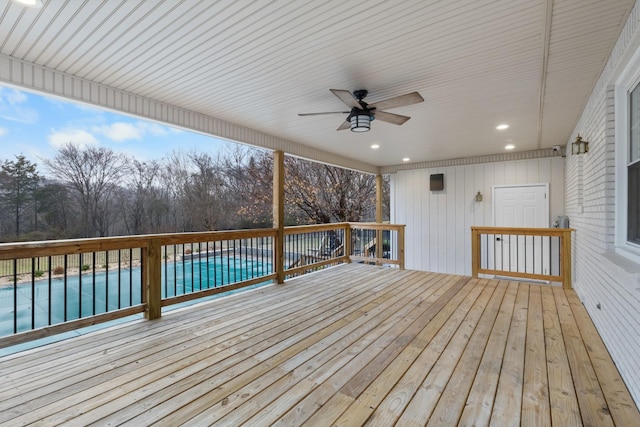 wooden terrace featuring ceiling fan