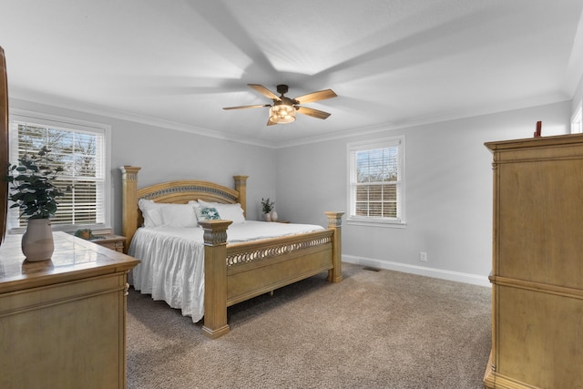 bedroom featuring crown molding, carpet floors, and ceiling fan