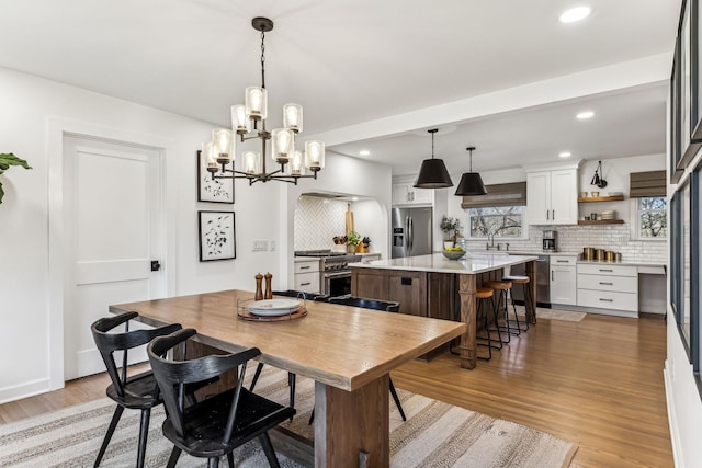 dining area with hardwood / wood-style floors