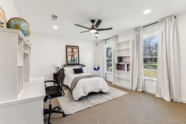 carpeted bedroom with ceiling fan