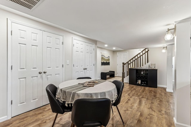 dining room with hardwood / wood-style floors