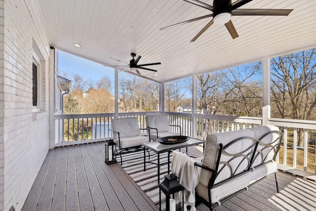 wooden deck with ceiling fan