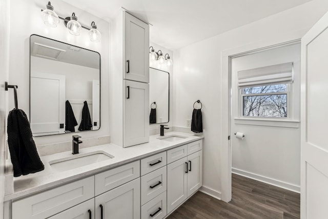 bathroom with vanity and hardwood / wood-style floors