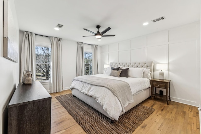 bedroom featuring light hardwood / wood-style flooring and ceiling fan