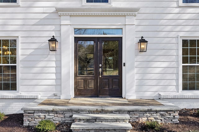 entrance to property featuring french doors