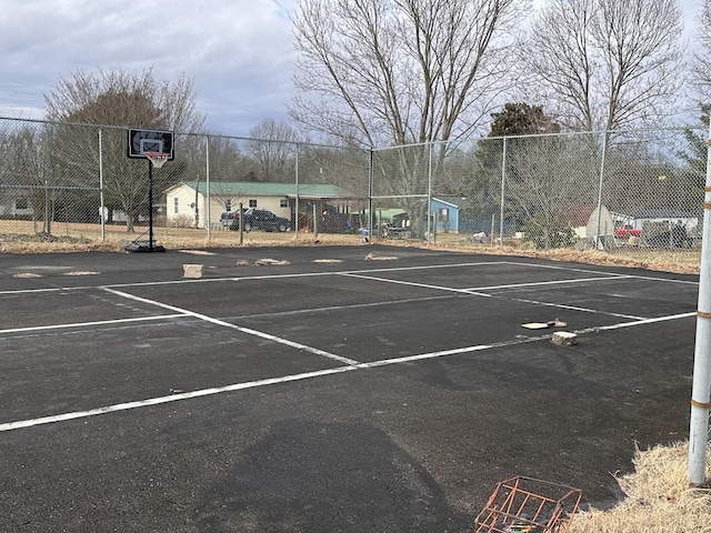 view of parking with basketball court